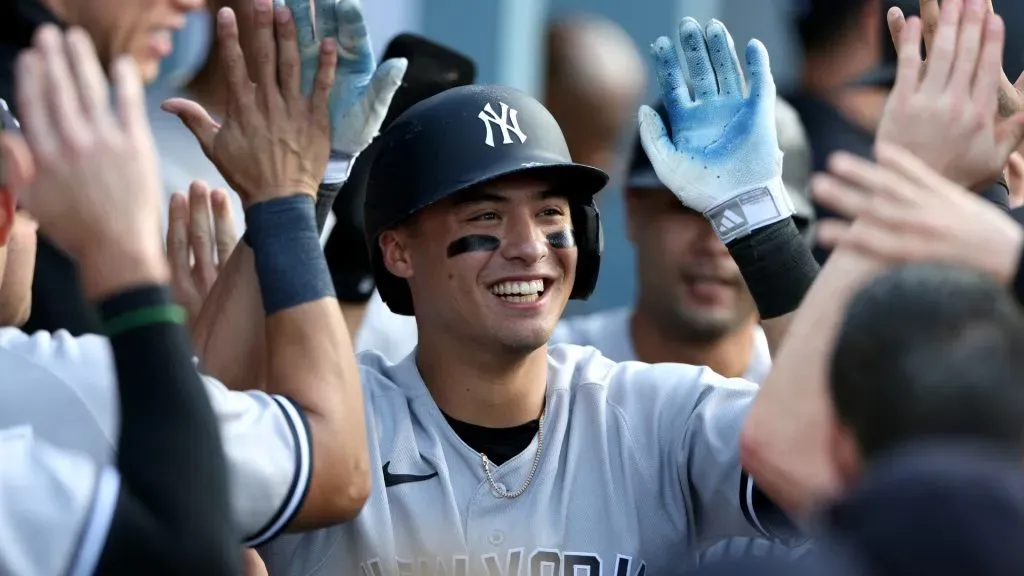 Anthony Volpe #11 of the New York Yankees celebrates his two run homerun in the dugout, to take a 4-1 lead over the Los Angeles Dodgers, during the ninth inning on June 04, 2023. (Source: Harry How/Getty Images)