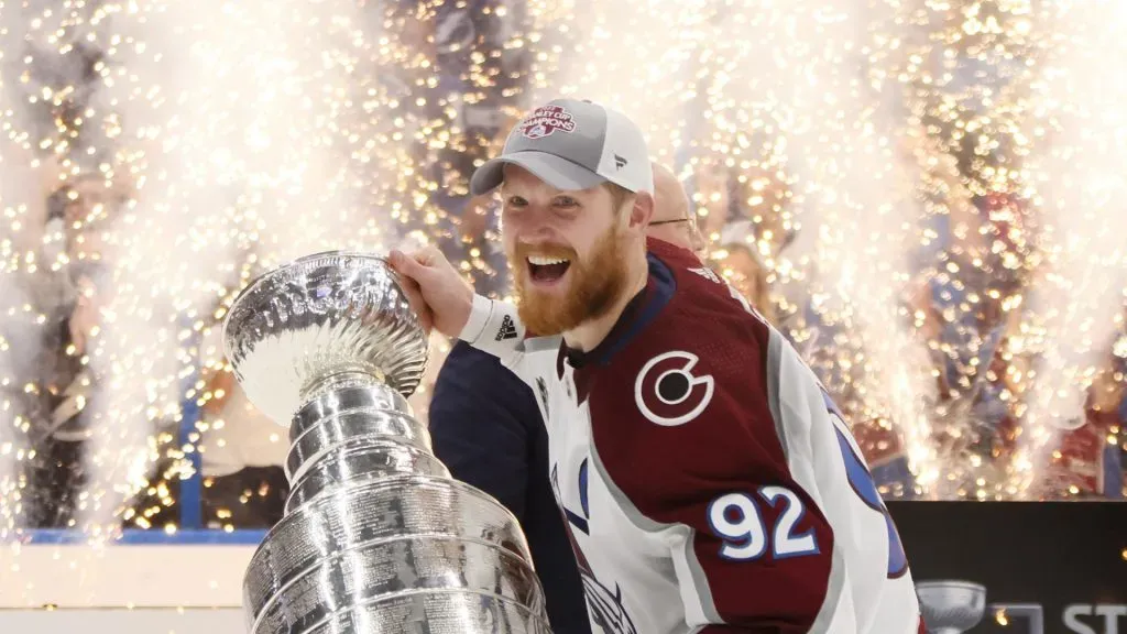 Gabriel Landeskog #92 of the Colorado Avalanche lifts the Stanley Cup after defeating the Tampa Bay Lightning 2-1 in Game Six of the 2022 NHL Stanley Cup Final at Amalie Arena on June 26, 2022 in Tampa, Florida.
