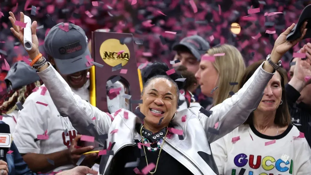 Head coach Dawn Staley of the South Carolina Gamecocks celebrates as the confetti falls after beating Iowa Hawkeyes in the 2024 NCAA Women’s Basketball Tournament National Championship at Rocket Mortgage FieldHouse on April 07, 2024 in Cleveland, Ohio.
