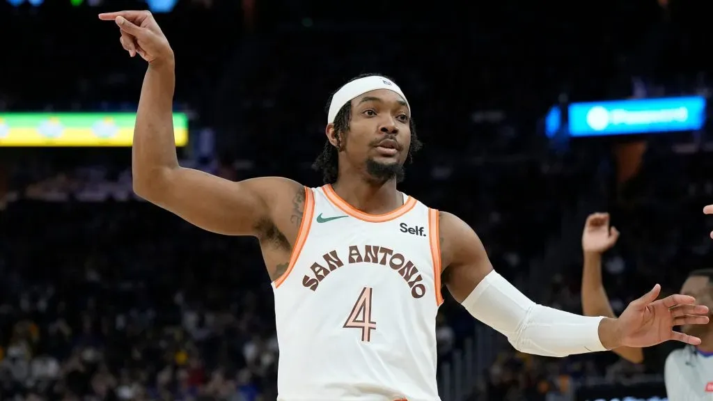 Devonte’ Graham #4 of the San Antonio Spurs reacts after making a three-point shot against the Golden State Warriors during the third quarter at Chase Center on March 09, 2024 in San Francisco, California. (Photo by Thearon W. Henderson/Getty Images)