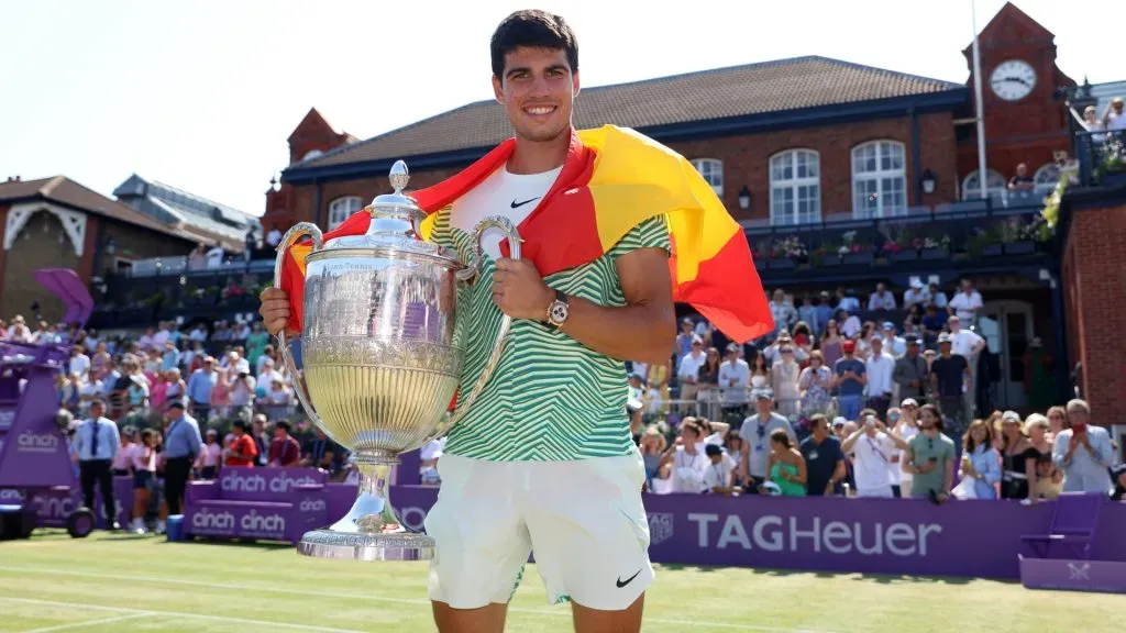 Carlos Alcaraz of Spain poses with the winnerās trophy after victory against Alex De Minaur of Australia at The Queenās Club. (Luke Walker/Getty Images for LTA)