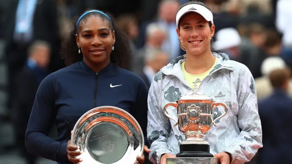 Runner up Serena Williams of the United States and Champion Garbine Muguruza of Spain pose with the trophies following the 2016 Roland Garros. (Julian Finney/Getty Images)