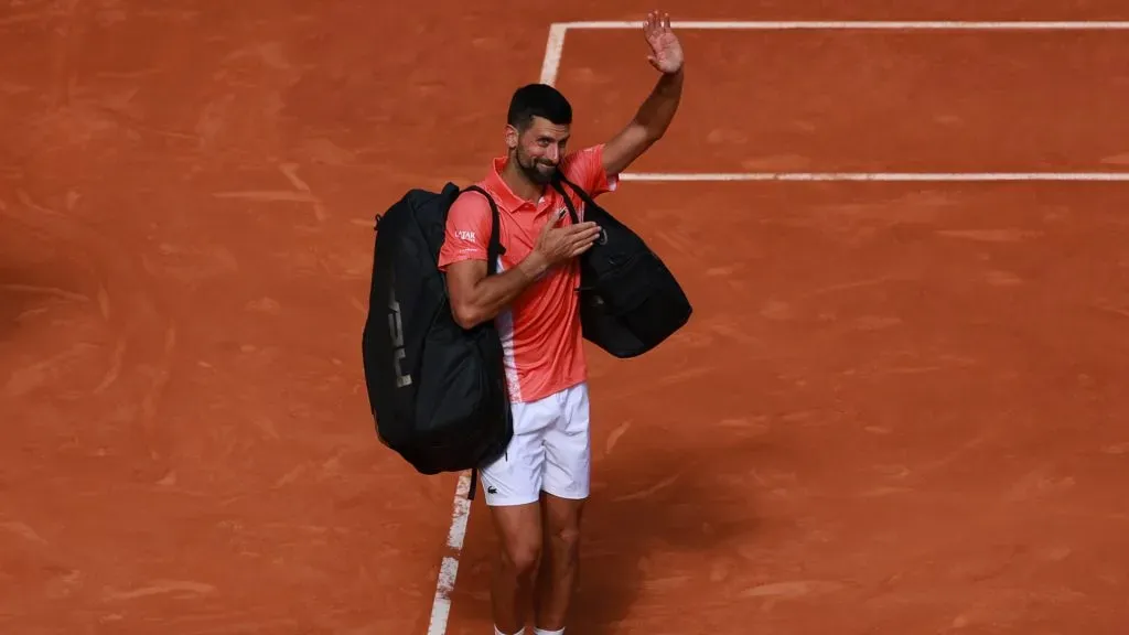 Novak Djokovic of Serbia waves to the crowd as he walks off court after his loss to Matteo Arnaldi of Italy in the Madrid Open. (Clive Brunskill/Getty Images)