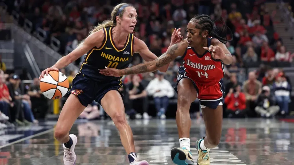 Lexie Hull #10 of the Indiana Fever dribbles past Zaay Green #14 of the Washington Mystics during the second half at Gainbridge Fieldhouse on May 3, 2025. (Source: Geoff Stellfox/Getty Images)