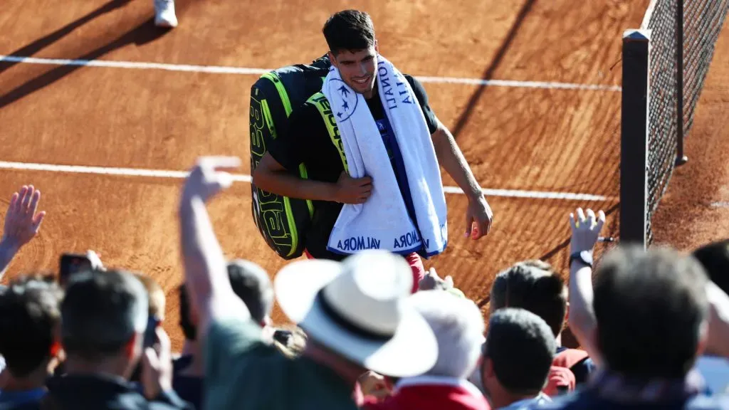 Carlos Alcaraz of Spain smiles as he walks over to the fans to sign autographs after a training session on Day Two of the Rome Open. (Dan Istitene/Getty Images)