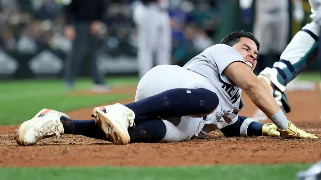 Oswaldo Cabrera #95 of the New York Yankees scores a run against the Seattle Mariners during the ninth inning but injures himself