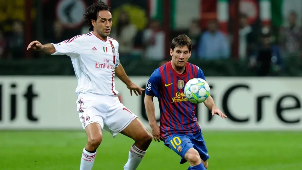 Alessandro Nesta of AC Milan and Lionel Messi of Barcelona compete for the ball during the 2012 UEFA Champions League. (Claudio Villa/Getty Images)
