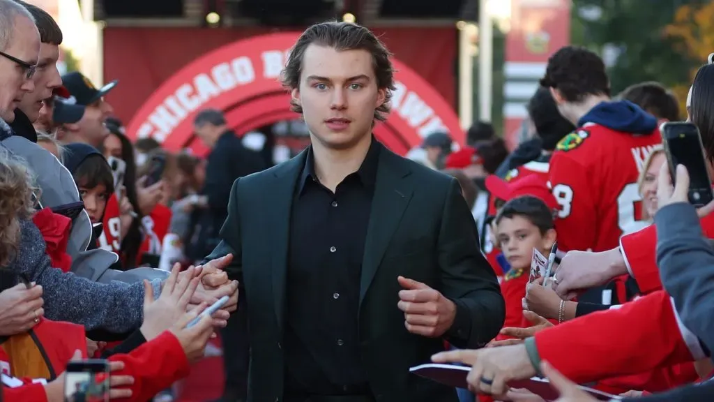 Connor Bedard #98 of the Chicago Blackhawks arrives to the red carpet prior to the Chicago Blackhawks home opener against the San Jose Sharks at the United Center on October 17, 2024 in Chicago, Illinois.