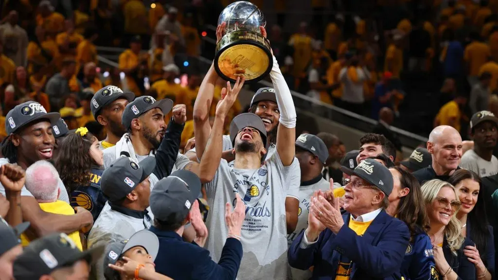 Tyrese Haliburton celebrates with the Bob Cousy Trophy after the 125-108 win against the New York Knicks in Game Six of the Eastern Conference Finals of the 2025 NBA Playoffs. (Source: Gregory Shamus/Getty Images)