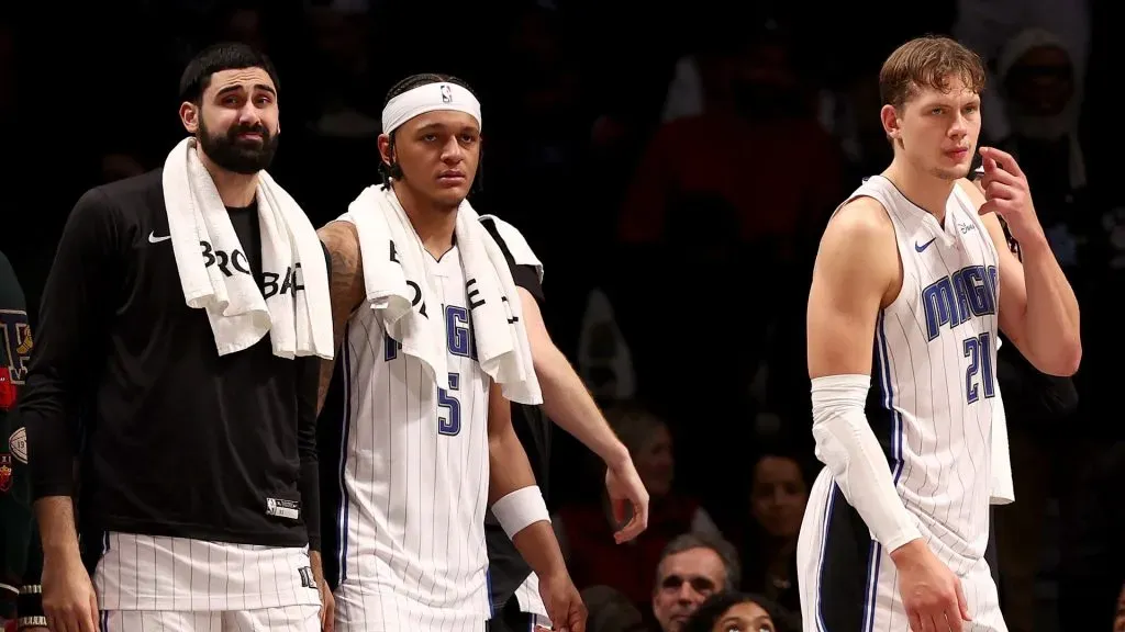 Goga Bitadze #35,Paolo Banchero #5 and Moritz Wagner #21 of the Orlando Magic react to the loss to the Brooklyn Nets