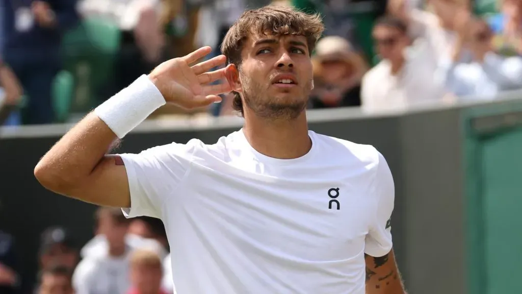 Flavio Cobolli of Italy gestures to his ear against Marin Cilic of Croatia during the Gentlemen’s Singles fourth round match on day eight of The Championships Wimbledon 2025. (Source: Clive Brunskill/Getty Images)