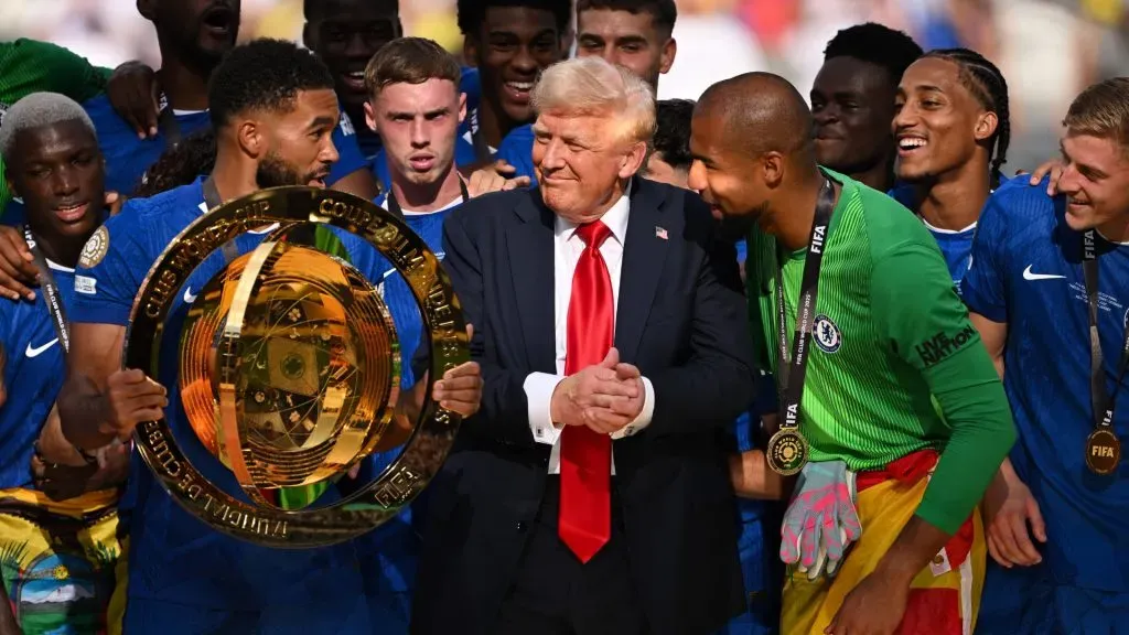 Reece James #24 of Chelsea FC holds the FIFA Club World Cup trophy after their team’s victory as intereacts with U.S. President Donald Trump (David Ramos/Getty Images)