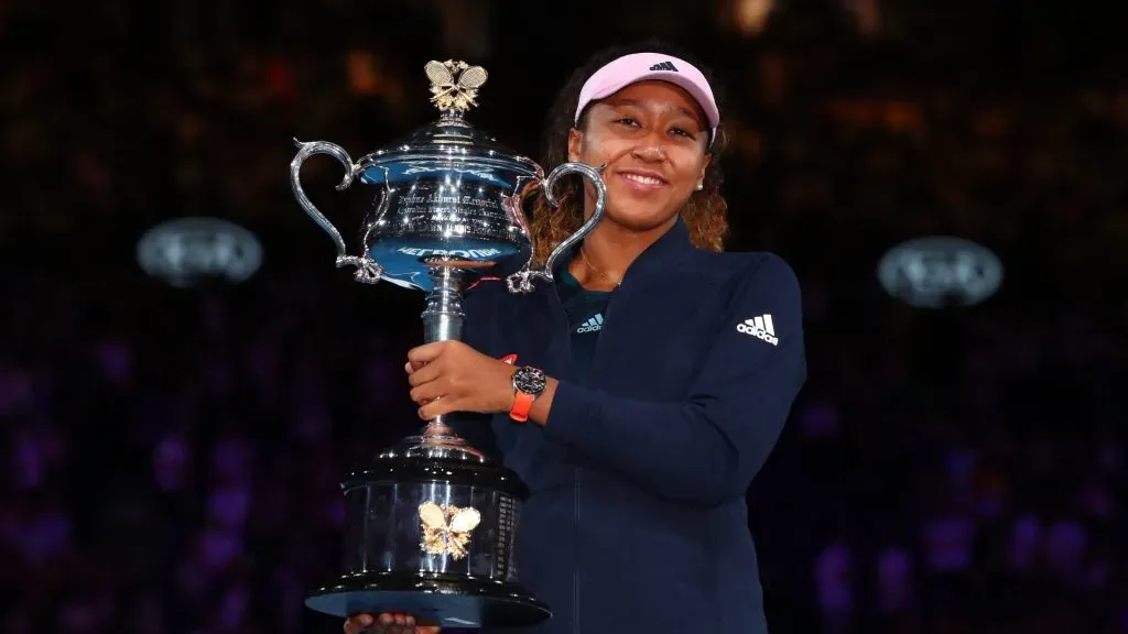 Naomi Osaka of Japan poses for a photo with the Daphne Akhurst Memorial Cup following victory in the 2019 Australian Open.