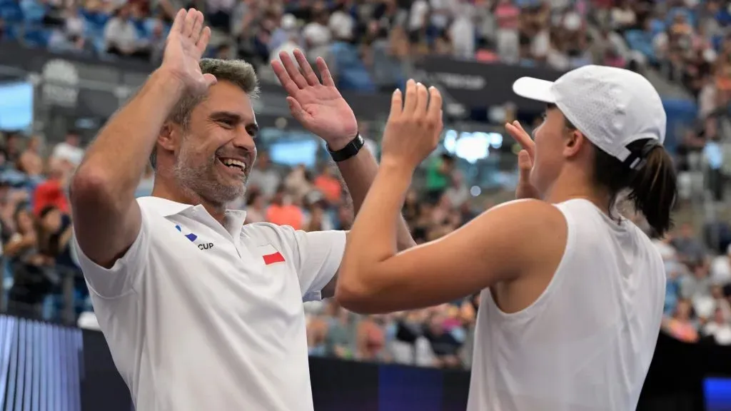 Iga Swiatek celebrates with Team Poland team captain Tomasz Wiktorowski after winning her final match against Angelique Kerber of Germany during the 2024 United Cup. (Brett Hemmings/Getty Images)