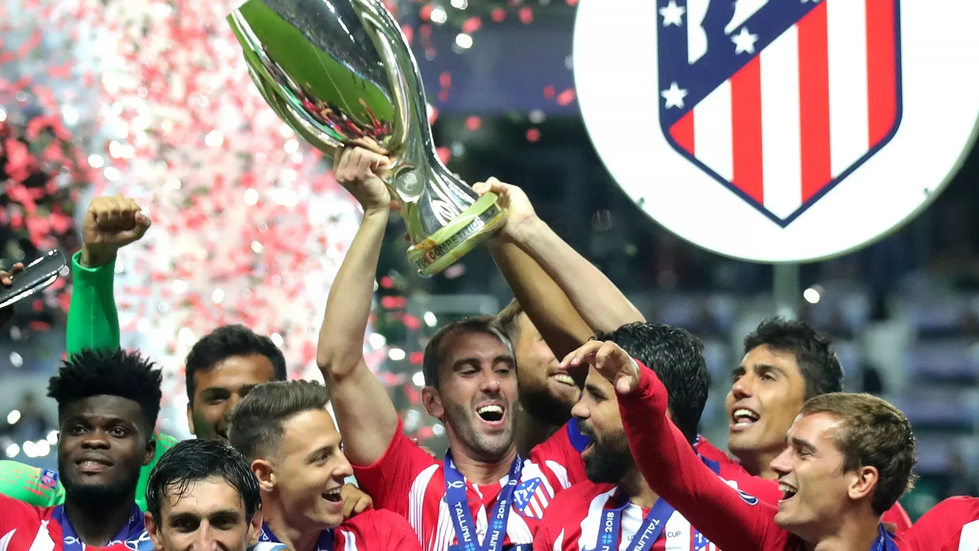 Diego Godin of Atletico Madrid lifts the trophy as Atletico Madrid celebrate victory in the UEFA Super Cup between Real Madrid and Atletico Madrid