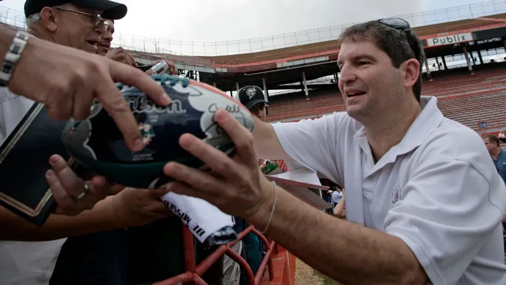 Former University of Miami Hurricanes Quarterback Bernie Kosar signs autographs for fans prior to the start of the final game at the Orange Bowl against the Miami Dolphins in 2008. (Source: Eliot J. Schechter/Getty Images)