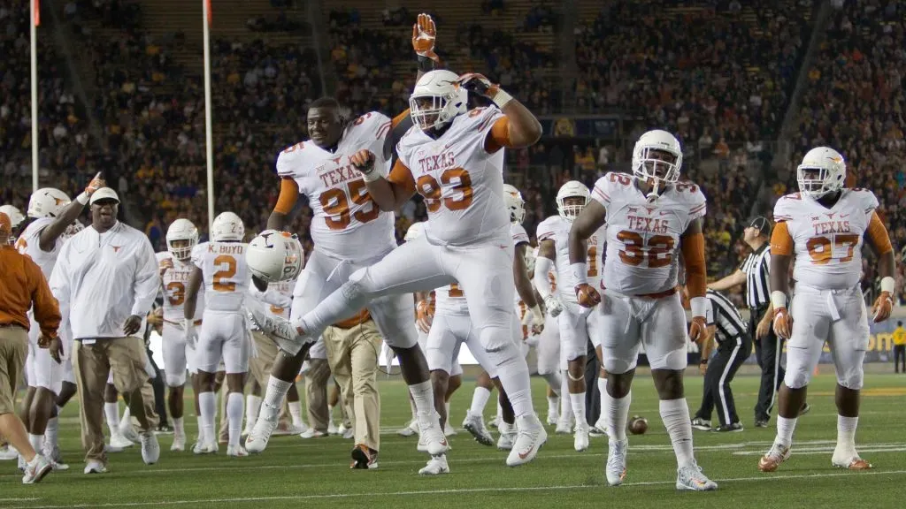 Paul Boyette Jr. and Poona Ford #95 of the Texas Longhorns celebrate in 2016. (Source: Brian Bahr/Getty Images)