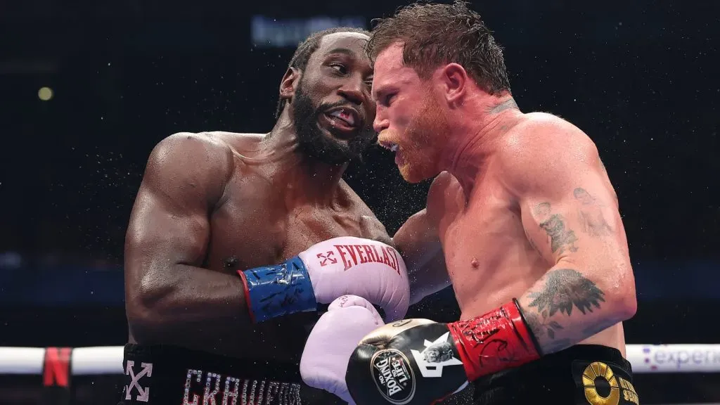 Terence Crawford exchanges punches with Canelo Alvarez in their undisputed super middleweight title fight. (Photo by Sarah Stier/Getty Images for Netflix)