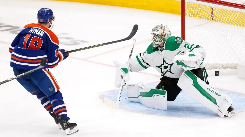 Hyman #18 of the Oilers scores a goal against Oettinger #29 of the Stars during the 2025 Stanley Cup Playoffs. (Photo by Codie McLachlan/Getty Images)