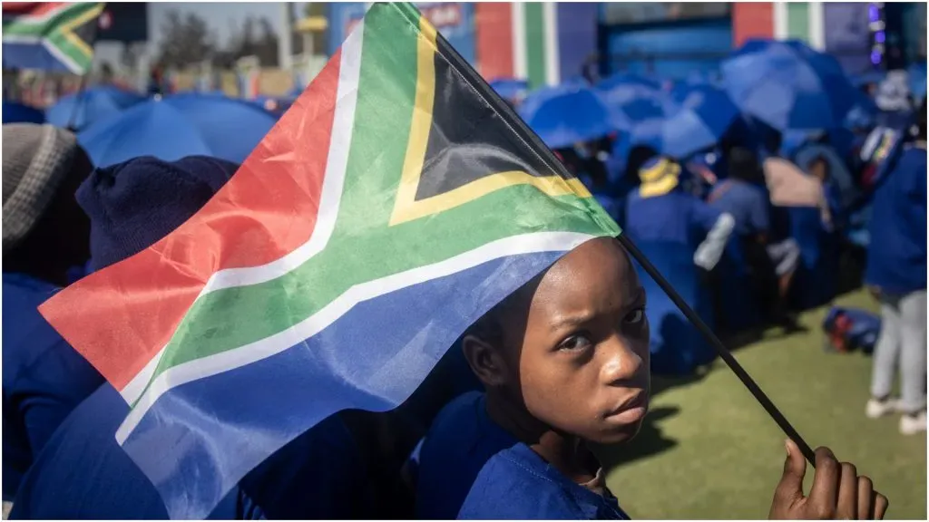 supporter holds a South African flag â Chris McGrath/Getty Images