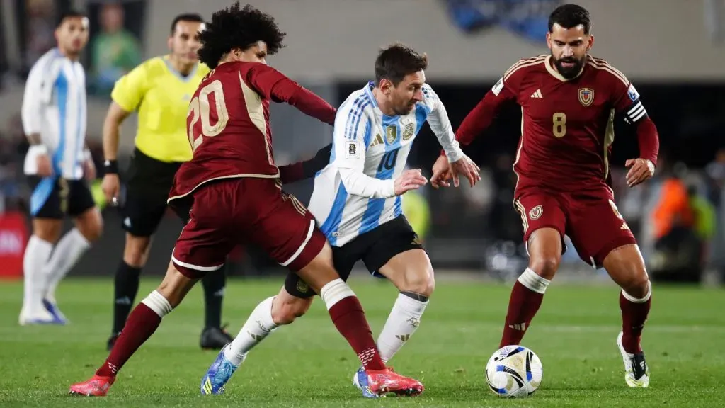 Lionel Messi is challenged during the South American FIFA World Cup 2026 Qualifier match between Argentina and Venezuela. Marcos Brindicci/Getty Images