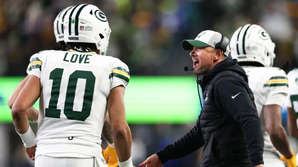 Head coach Matt LaFleur of the Green Bay Packers celebrates with Jordan Love #10 after a touchdown against the Seattle Seahawks during the first quarter of the game at Lumen Field on December 15, 2024 in Seattle, Washington.
