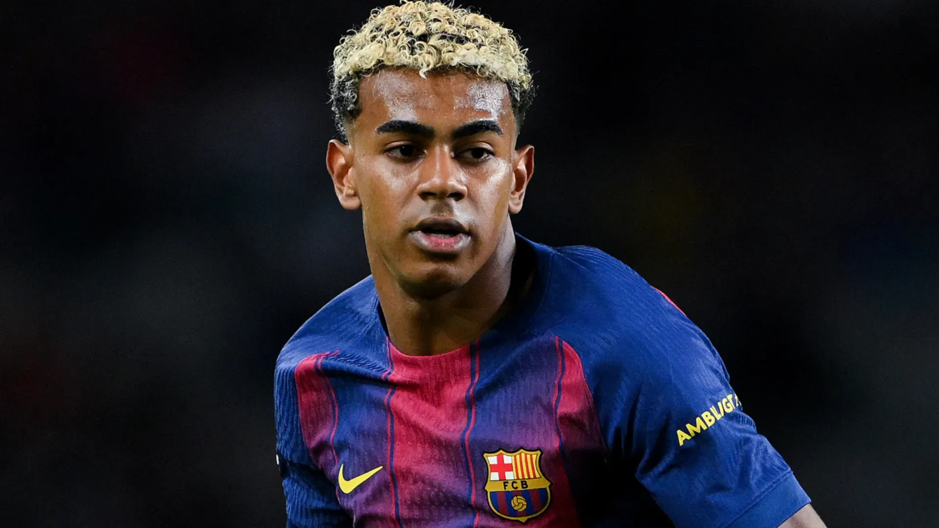 Barcelona star Lamine Yamal looking on