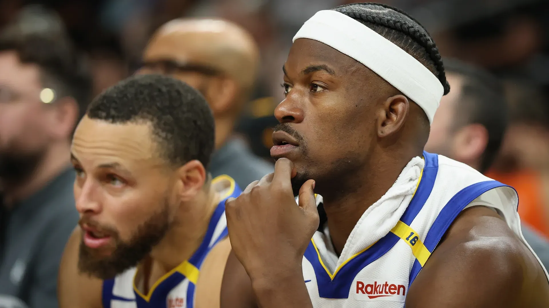 Stephen Curry and Jimmy Butler on the bench during an NBA regular season game