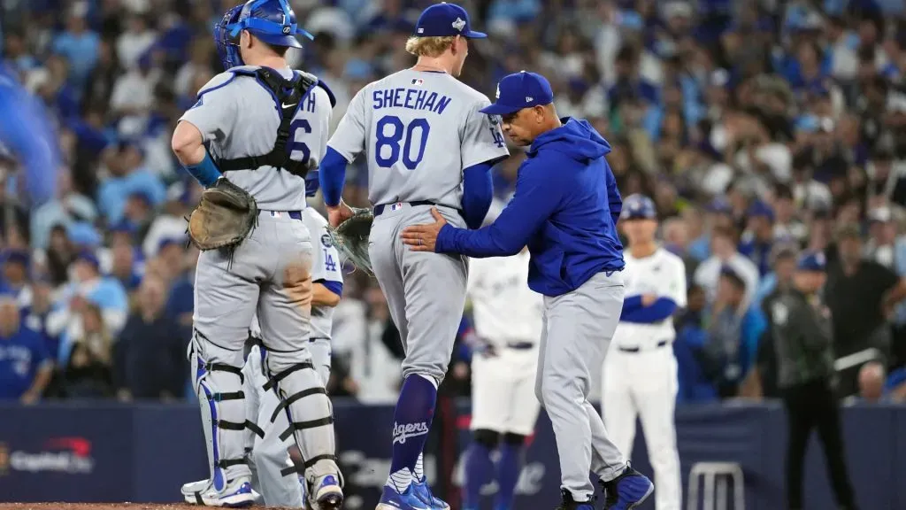 Emmet Sheehan #80 of the Dodgers walks to the dugout after a pitching change by manager Dave Roberts. Mark Blinch/Getty Images