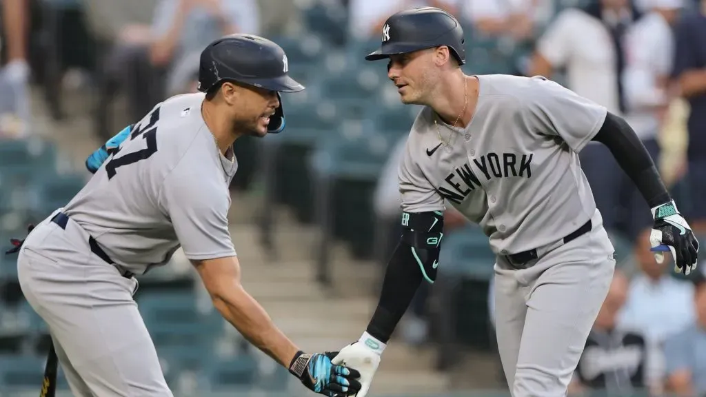 Cody Bellinger #35 of the Yankees celebrates with Giancarlo Stanton #27 after hitting a two-run home run. Michael Reaves/Getty Images