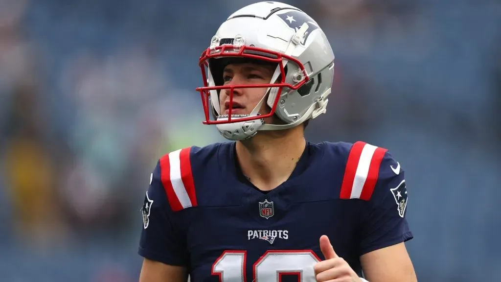 Drake Maye of the Patriots looks on before a game.
