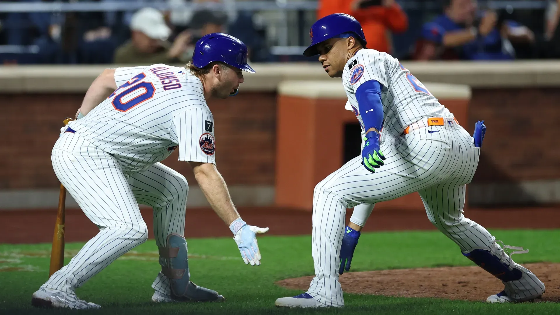 Juan Soto #22 and Pete Alonso #20 of the New York Mets react after a home run. Ishika Samant/Getty Images