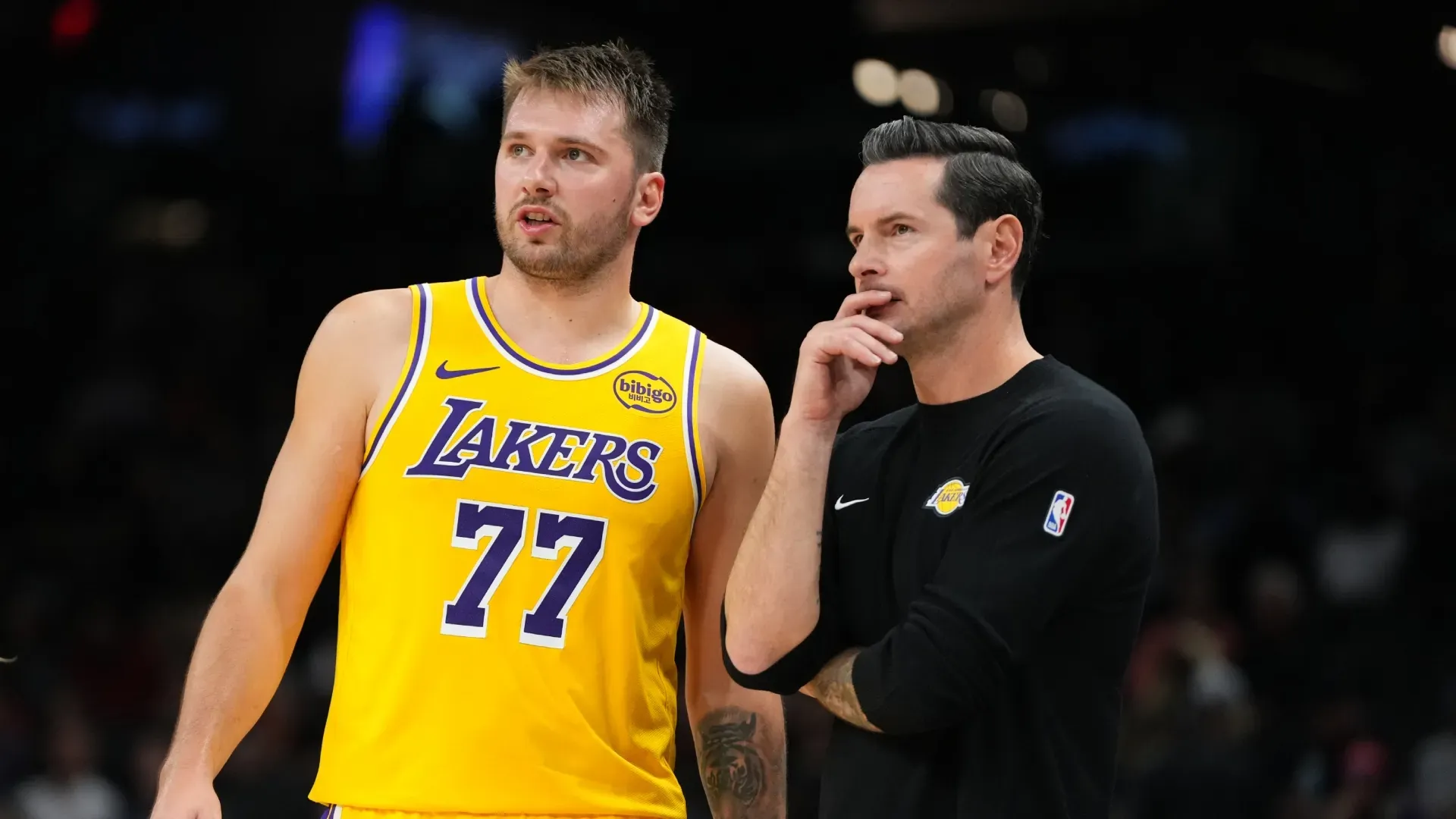 Luka Doncic and JJ Redick in the sideline