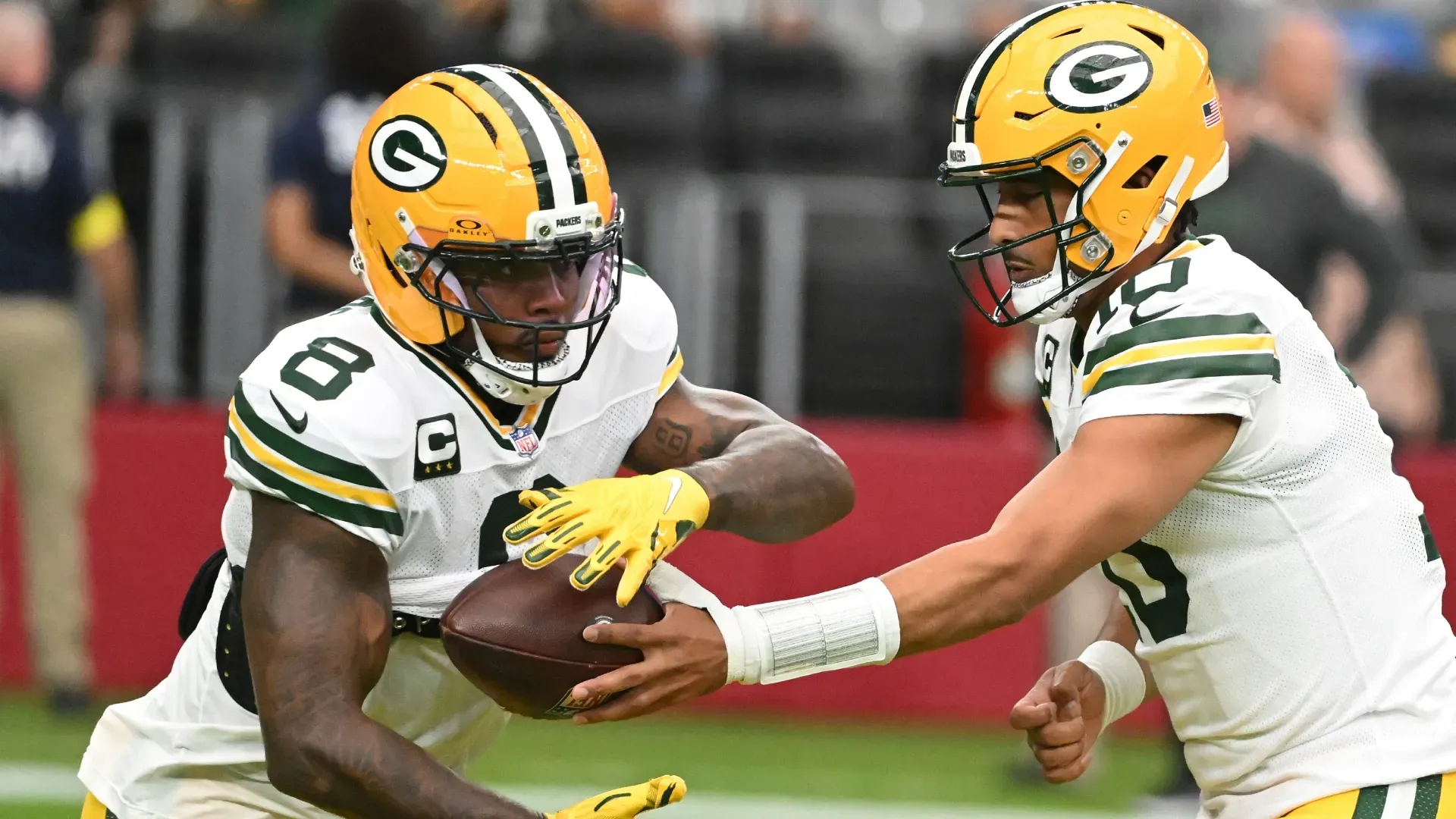 Josh Jacobs with Jordan Love