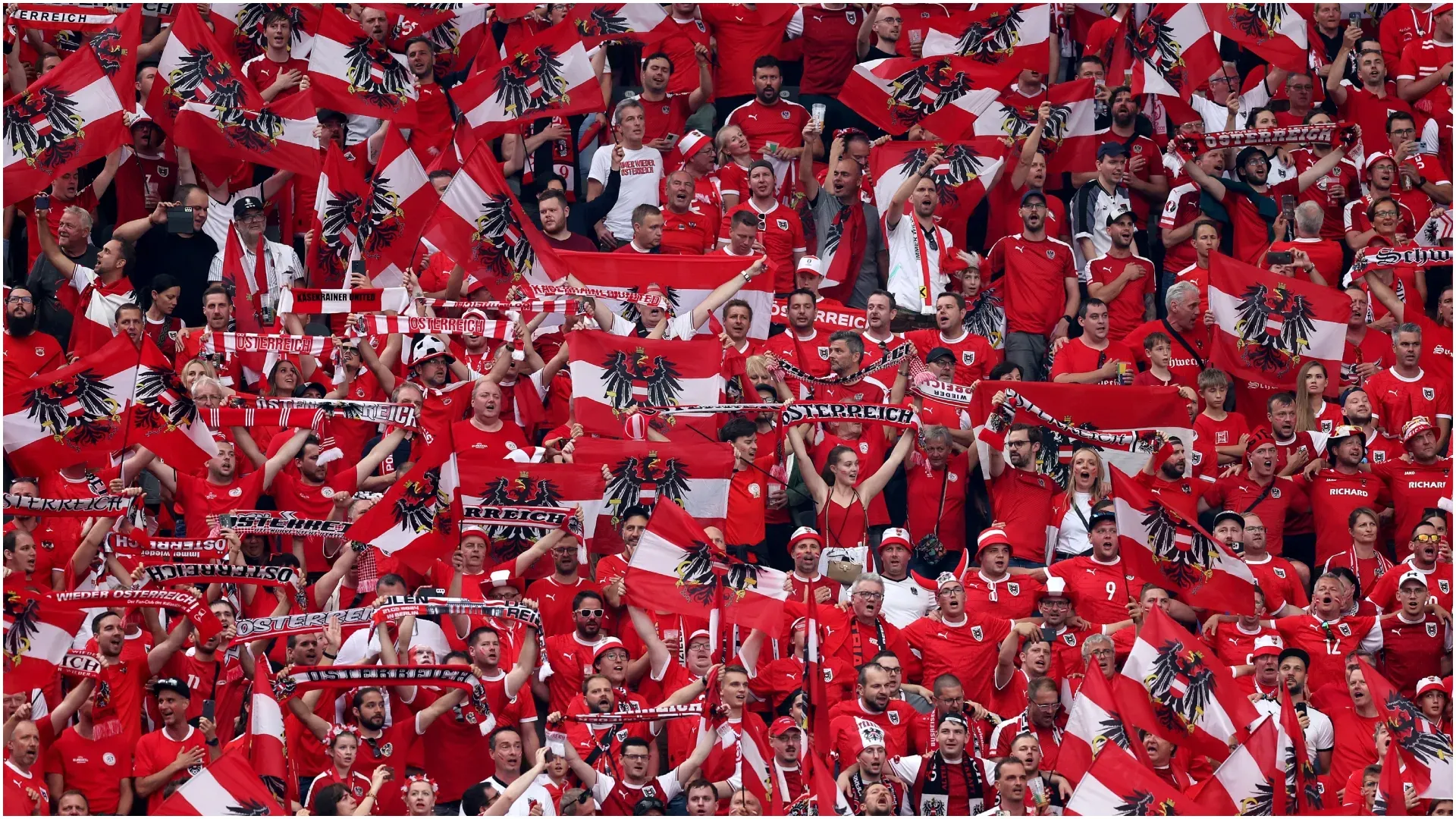 Austria fans hold up national flags – Julian Finney/Getty Images