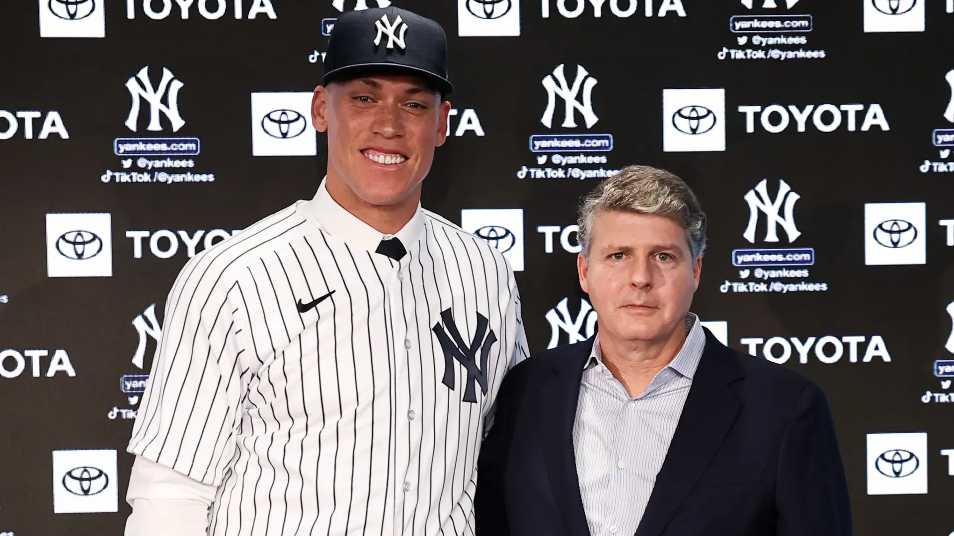 Aaron Judge #99 of the New York Yankees poses for a photo with Yankees principal owner Hal Steinbrenner. Dustin Satloff/Getty Images