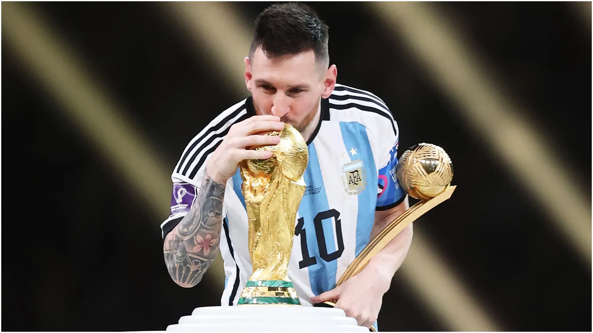 Lionel Messi of Argentina kisses the FIFA World Cup Qatar 2022 Winners’ Trophy – Julian Finney/Getty Images