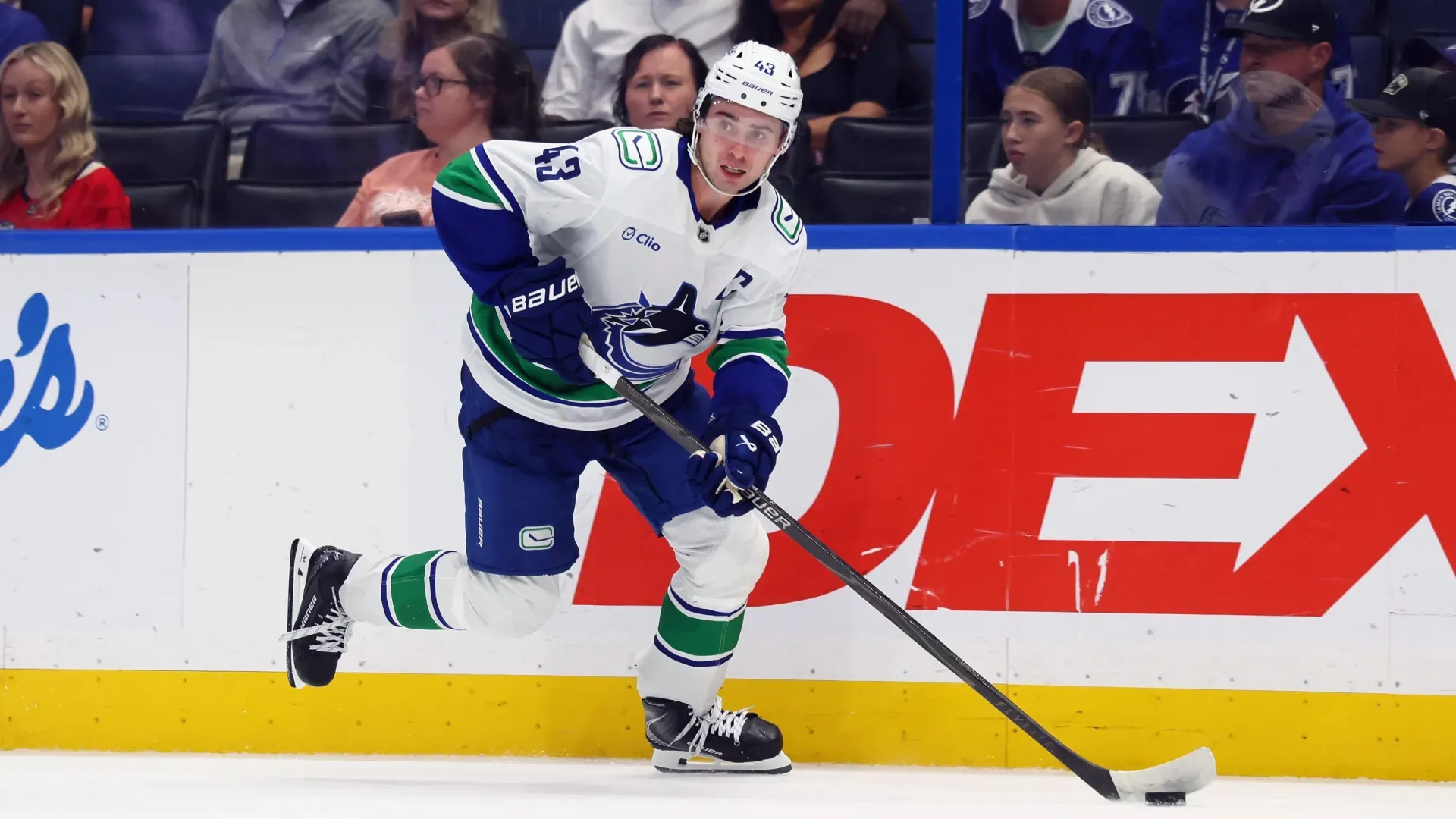 Quinn Hughes #43 with the Canucks skates against the Lightning. Bruce Bennett/Getty Images