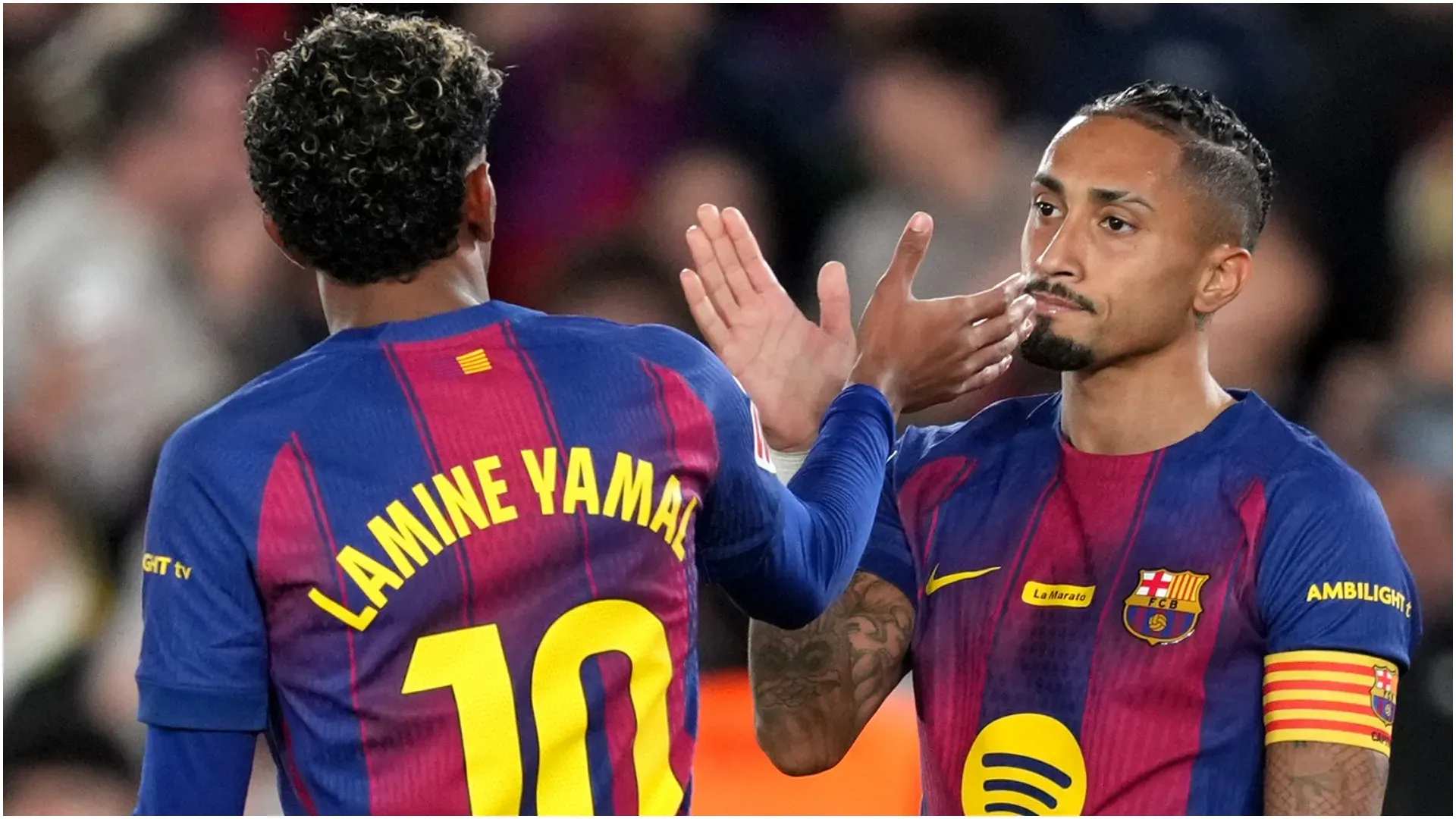 Raphinha of FC Barcelona (R) celebrates scoring his teamās first goal with teammate Lamine Yamal (L) ā Alex Caparros/Getty Images