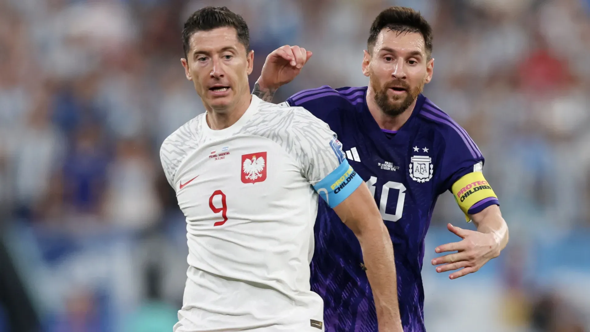 Robert Lewandowski with Lionel Messi