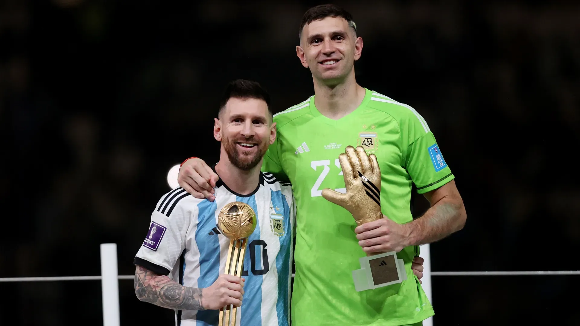 Lionel Messi and Emiliano Martinez