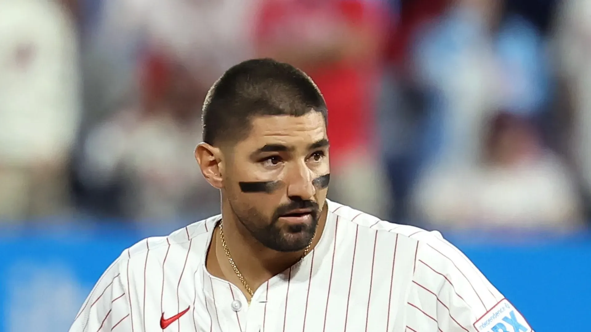 Nick Castellanos looks on.