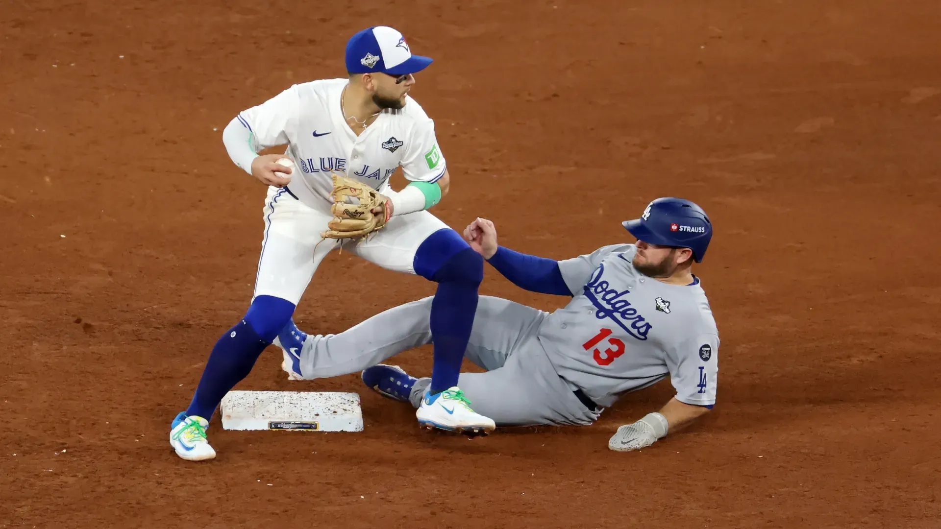 Bo Bichette #11 of the Blue Jays forces Max Muncy #13 of the Dodgers out. Patrick Smith/Getty Images