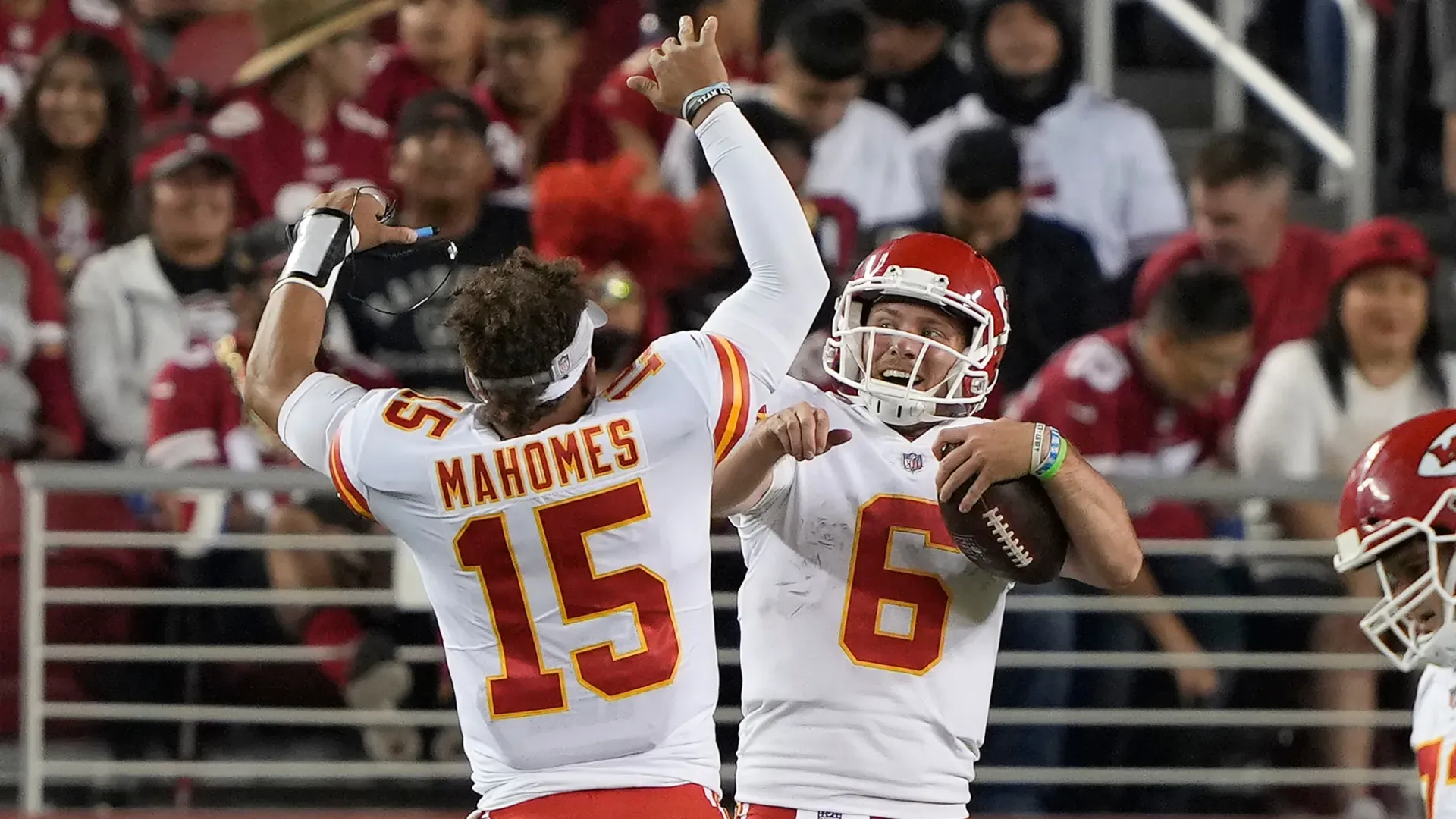 Shane Buechele and Patrick Mahomes celebrating.