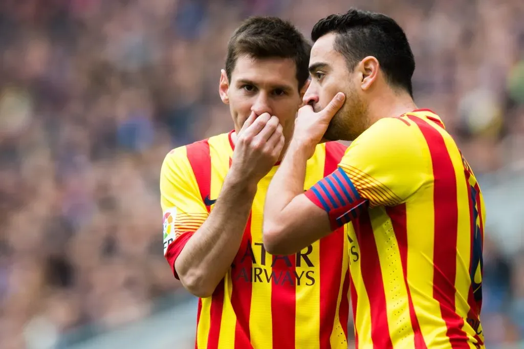 BARCELONA, SPAIN – MARCH 29: Lionel Messi (L) and Xavi Hernandez of FC Barcelona speak during the La Liga match between RCD Espanyol and FC Barcelona at Cornella-El Prat Stadium on March 29, 2014 in Barcelona, Spain. (Photo by Alex Caparros/Getty Images)