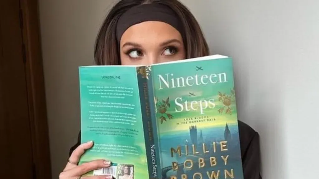 Millie Bobby Brown with her book in 2023 (Source: @TheFilmBase)