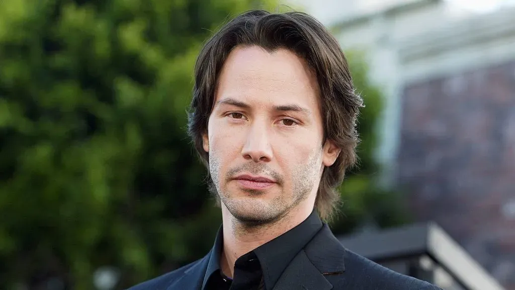 Actor Keanu Reeves arrives at the premiere of “The Matrix Reloaded” at the Village Theater on May 7, 2003 in Los Angeles, California. (Photo by Kevin Winter/Getty Images)