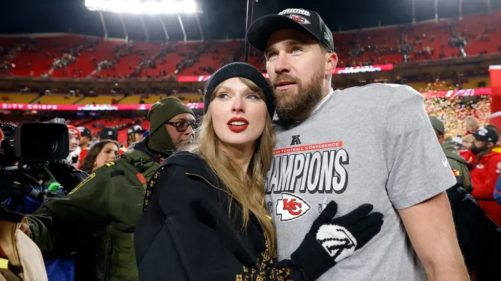 Taylor Swift celebrates with Travis Kelce #87 of the Kansas City Chiefs after defeating the Buffalo Bills 32-29 in the AFC Championship Game at GEHA Field at Arrowhead Stadium on January 26, 2025 in Kansas City, Missouri. (Photo by David Eulitt/Getty Images)