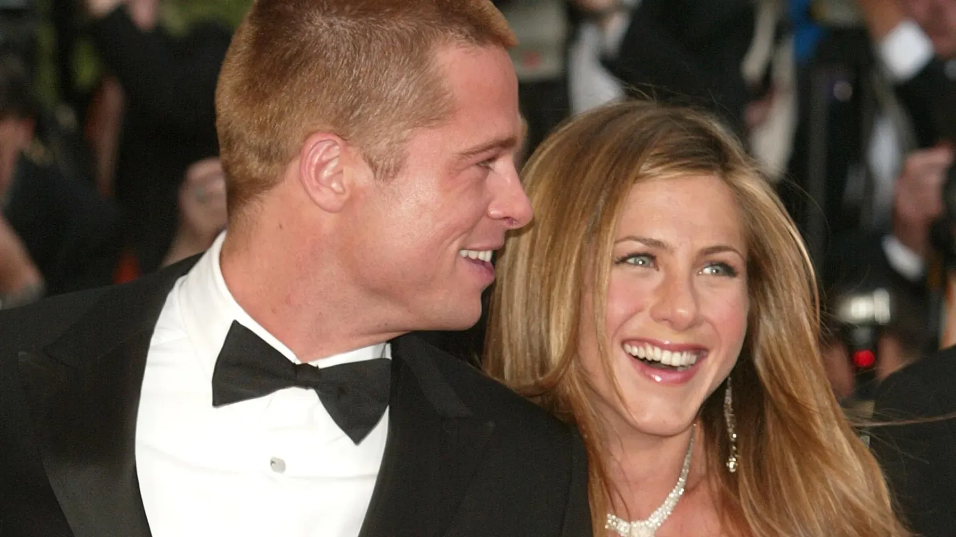 Actor Brad Pitt and wife actress Jennifer Aniston attend the World Premiere of the epic movie “Troy” at Le Palais de Festival on May 13, 2004 in Cannes, France. Aniston wears a dress by Versace. (Photo by Evan Agostini/Getty Images)