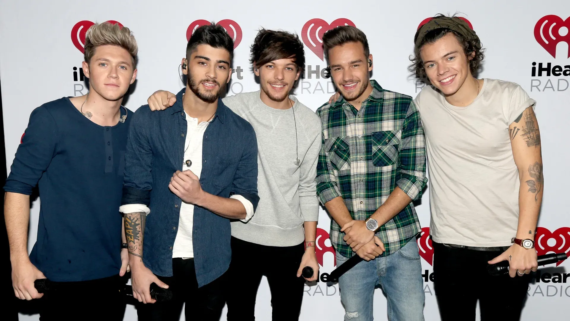 (L-R) Musicians Niall Horan, Zayn Malik, Louis Tomlinson, Liam Payne, and Harry Styles of the band One Direction during the “One Direction iHeartRadio Album Release Party” hosted by Ryan Seacrest at the iHeartRadio Theater Los Angeles Clear Channel’s new music and events venue located at The Burbank Studios in Burbank, CA (Photo by Christopher Polk/Getty Images for Clear Channel)